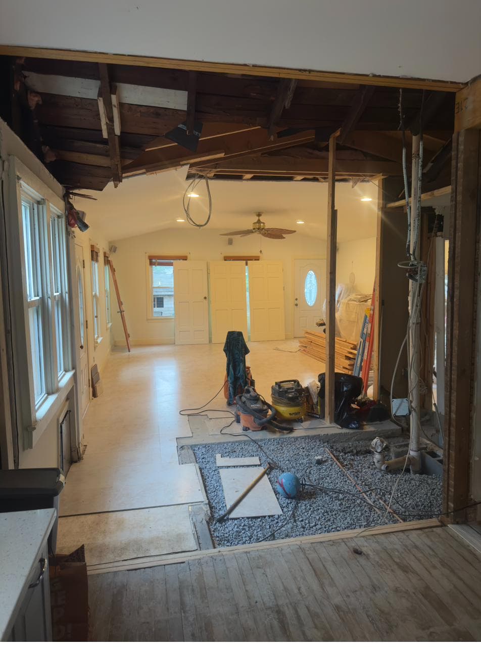 Gravel and plumbing rough-in where the old bathroom stood