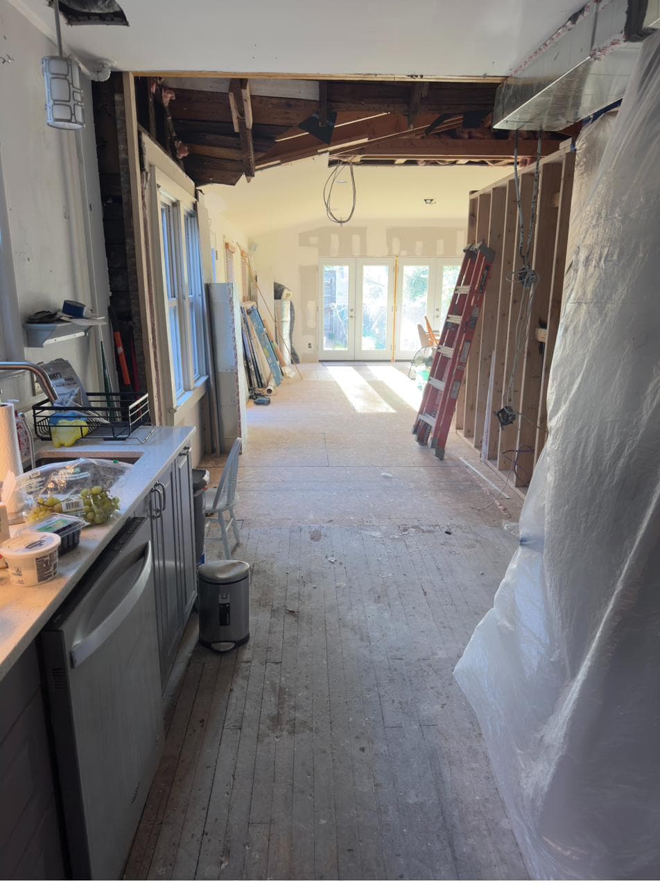 Galley kitchen view toward the new framed pantry